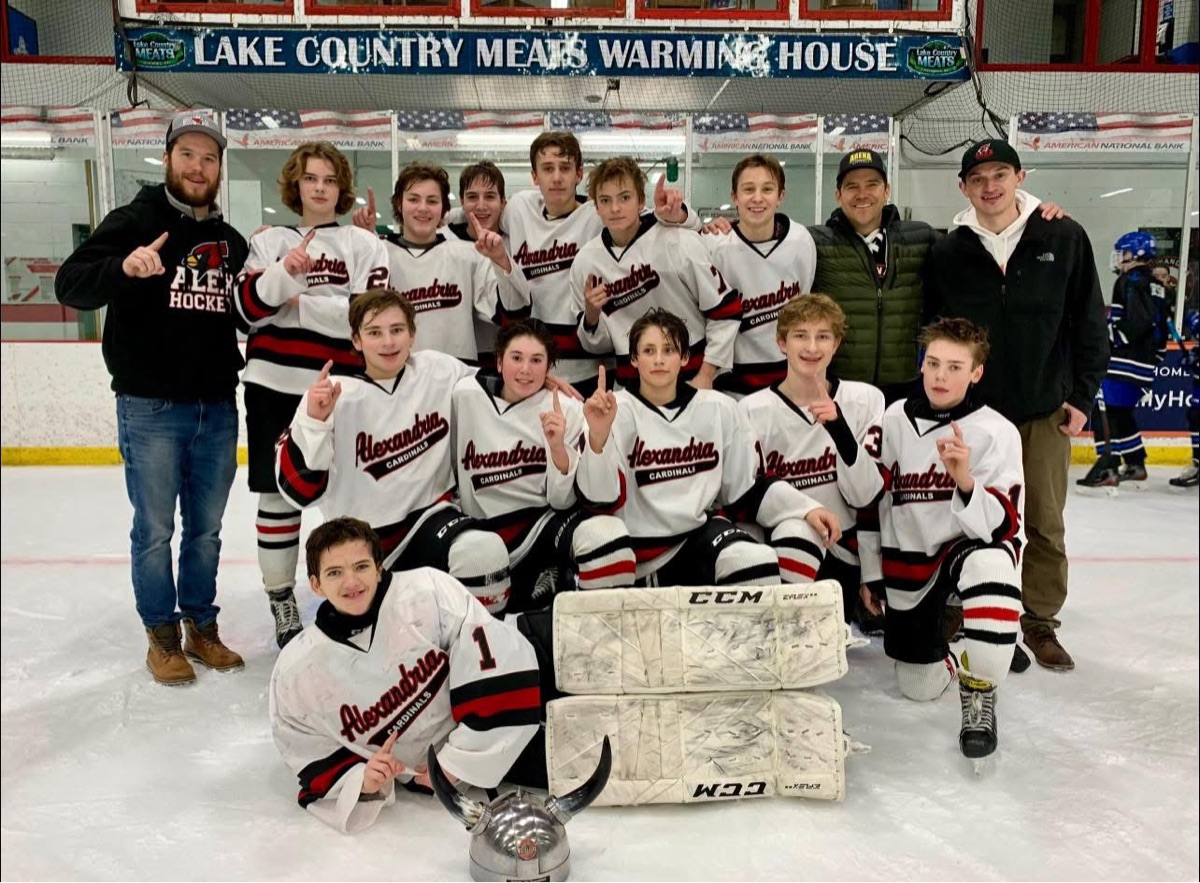 Jackson with his Alexandria Cardinals teammates after a win
