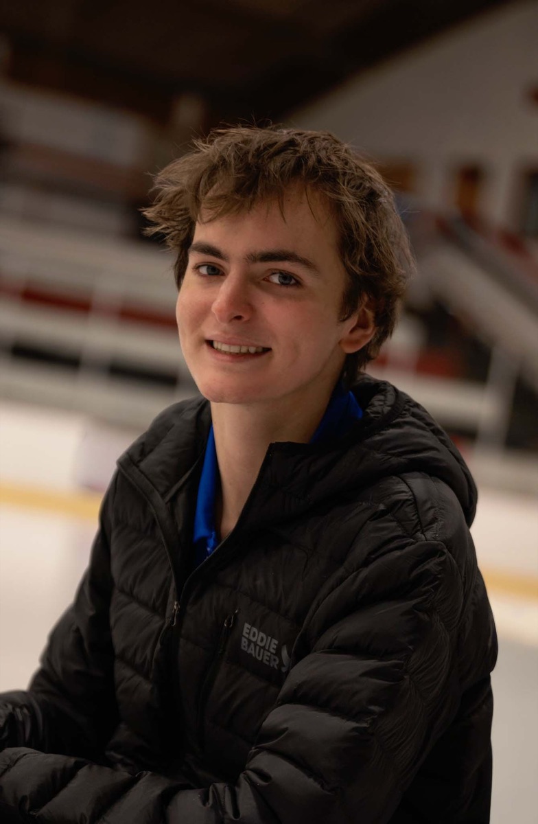 Portrait of Jackson smiling at the rink
