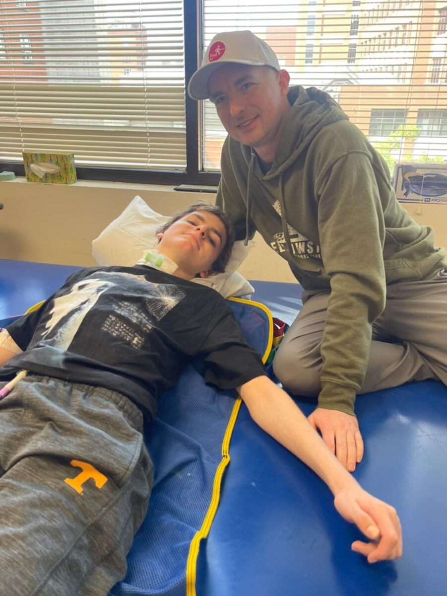 Jackson working with his dad Jason in therapy